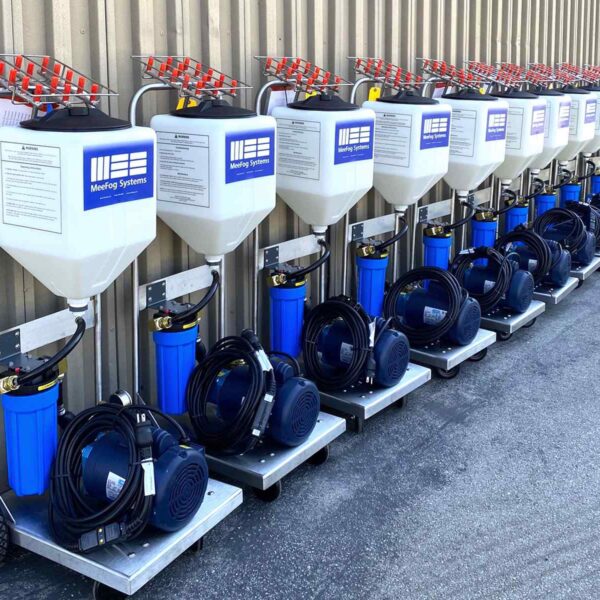 A row of nine MeeFog misting systems with tanks and blue filters, each connected to a black hose, efficiently lined up.